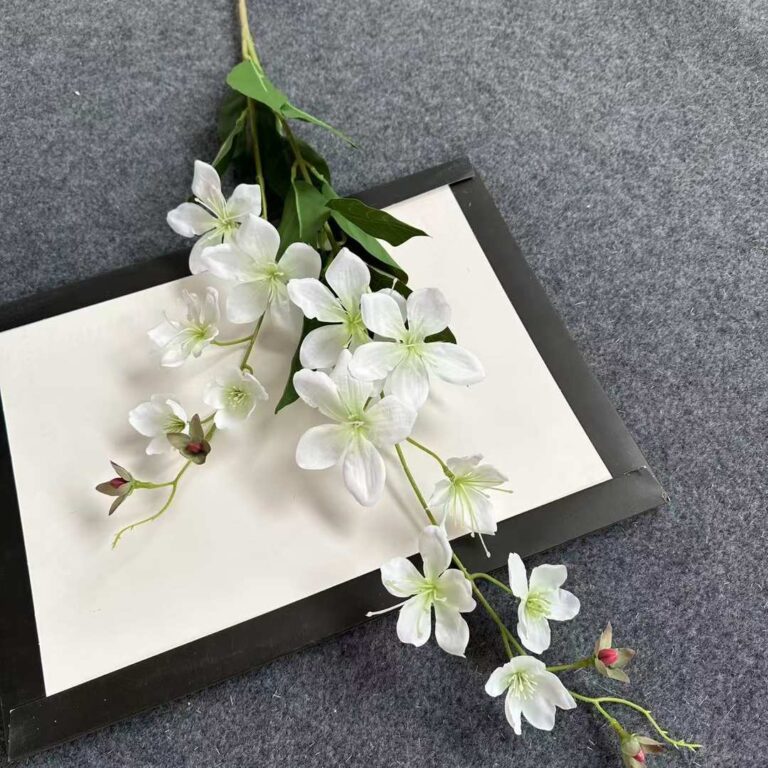 Elegant artificial white jasmine bouquet display on a framed card background.