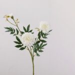 Artificial silk marigolds display featuring three creamy white bloom heads and rich greenery.