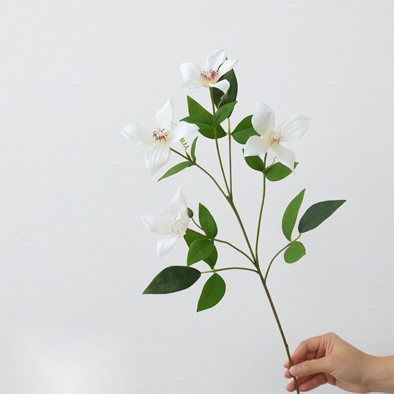 Artificial silk clematis flower arrangement with green leaves, ideal for everlasting home decor.