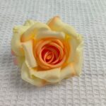 Realistic artificial silk rose head in yellow and orange tones, perfect for everlasting floral decor.