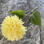 Realistic yellow silk pompon ball with green leaves, suitable for artificial wedding flowers or home decor.
