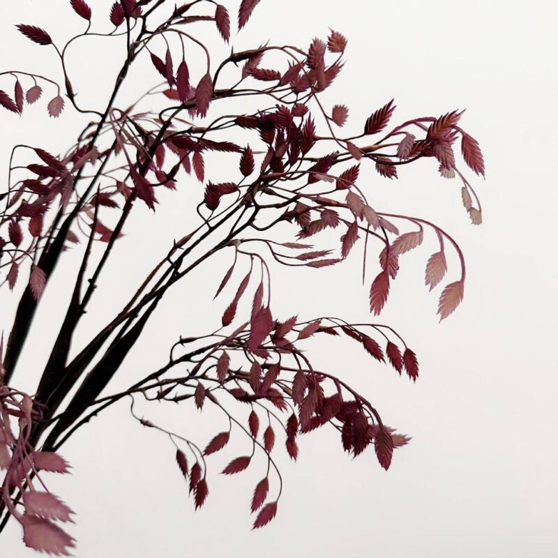 Deep red plastic leaf branches perfect for wedding centerpieces or realistic artificial home decor.