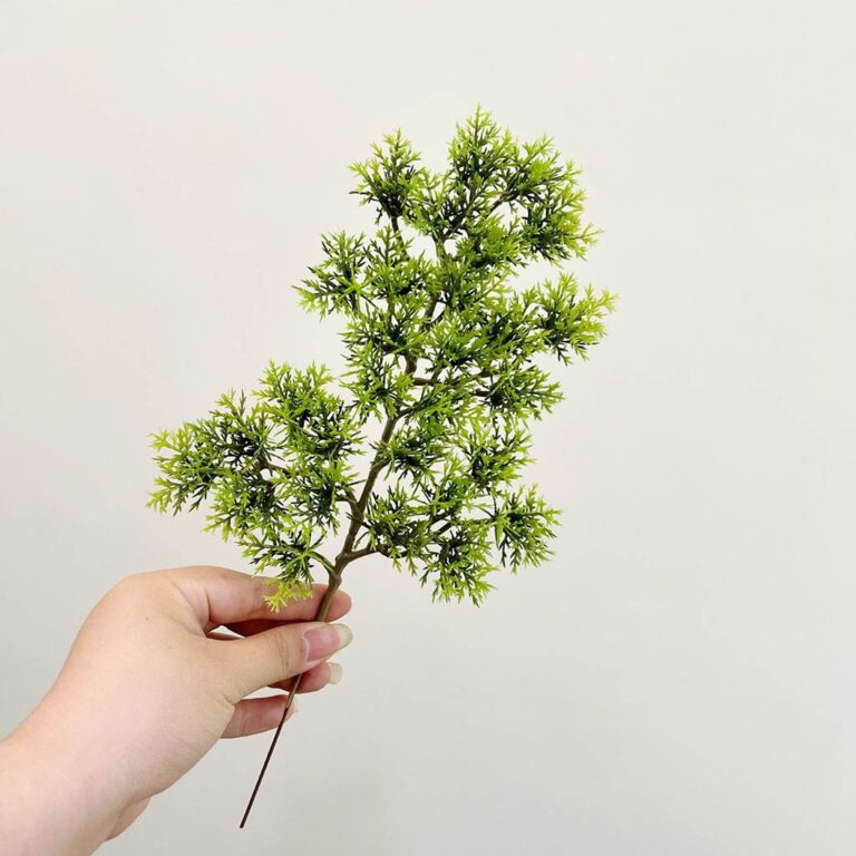 Realistic green artificial foliage stems suitable for wedding decorations or indoor home decor.