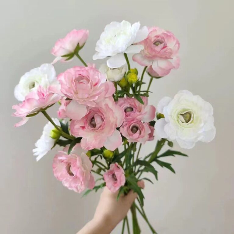 Realistic bouquet of white and pink silk artificial flowers, perfect for wedding or home decor accents.