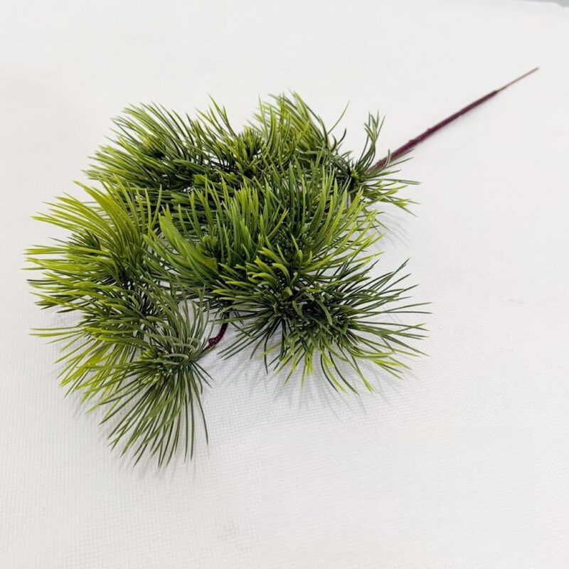 Realistic green faux foliage cluster, ideal for artificial wedding flowers or sophisticated home decor staging.