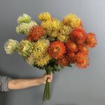 Vibrant faux flower stems bouquet for home decor or artificial wedding flowers centerpiece.