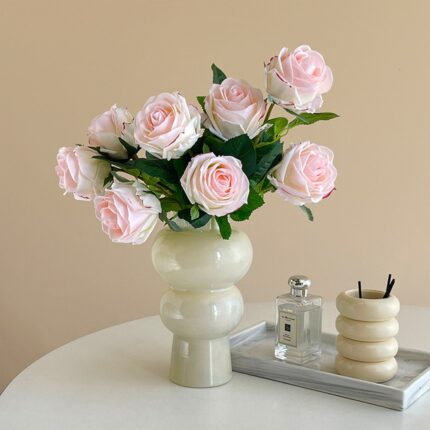 Realistic pink rose bouquet on faux flower stems, ideal for wedding or home décor.