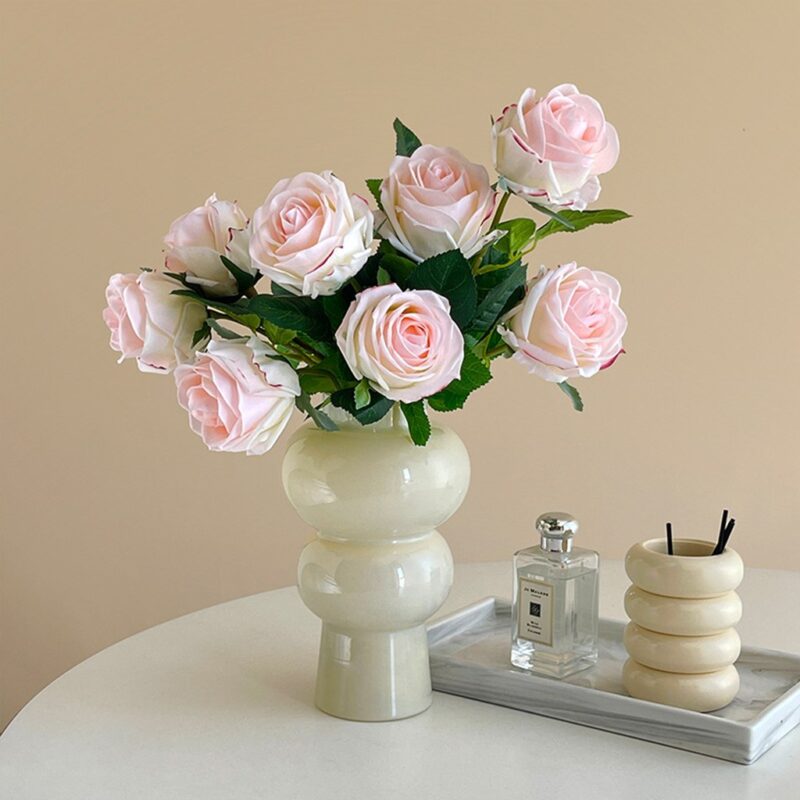Realistic pink rose bouquet on faux flower stems, ideal for wedding or home décor.