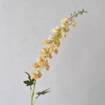 Silk artificial pale yellow delphinium flower spray for realistic floral accents and crafting