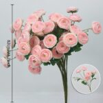 Bouquet of pink silk lotus flowers arranged in a lush, faux floral display for home decor.