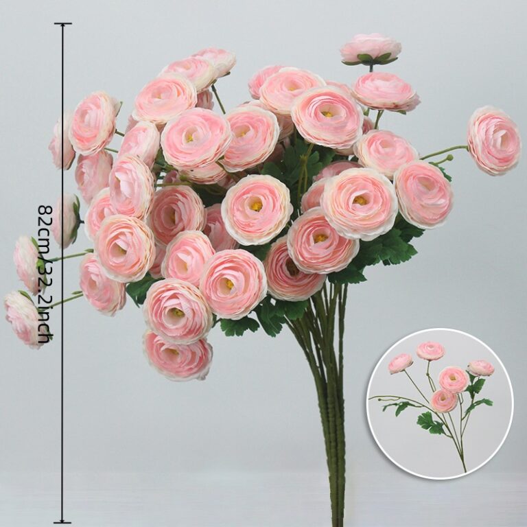 Bouquet of pink silk lotus flowers arranged in a lush, faux floral display for home decor.