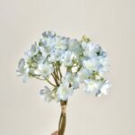 Silk jasmine bouquet of light blue artificial flowers.