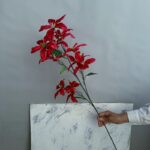 Silk artificial lily bouquet featuring 12 deep red flower heads for home decor arrangement.