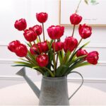 Bouquet of red silk tulips in a decorative gray vase, perfect for artificial spring floral arrangements.