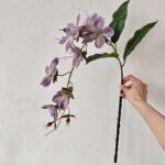3D artificial silk jasmine garland with realistic purple blooms and green foliage