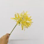 Artificial yellow Agapanthus flowers bouquet for decor on a stem