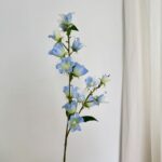 Artificial silk bluebell floral spray bunch in delicate shades of blue.