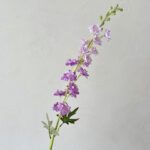 Artificial silk delphinium branch featuring light purple and lavender blossoms for floral home decor.