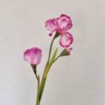 Three artificial pink silk irises on stems, perfect for everlasting home floral decor.