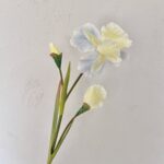 Artificial silk iris flowers in yellow, blue, and white tones for faux floral decor.