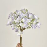 Artificial jasmine bouquet featuring delicate light purple and white silk flowers for home decor