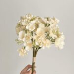 Artificial silk jasmine bouquet in ivory tones, perfect for wedding decor or elegant home accents.