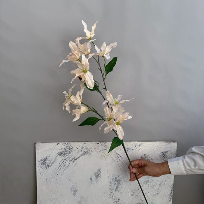 High-quality artificial silk lily arrangement, 12 faux white flower heads for elegant home decor.