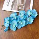 Realistic blue silk orchid bouquet with eight heads, perfect floral home decor.