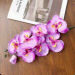 Artificial silk orchid cluster in purple and pink hues, perfect for everlasting home decor accents.