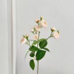 Artificial silk rose bouquet featuring 12 heads of soft peach flowers for everlasting decor.