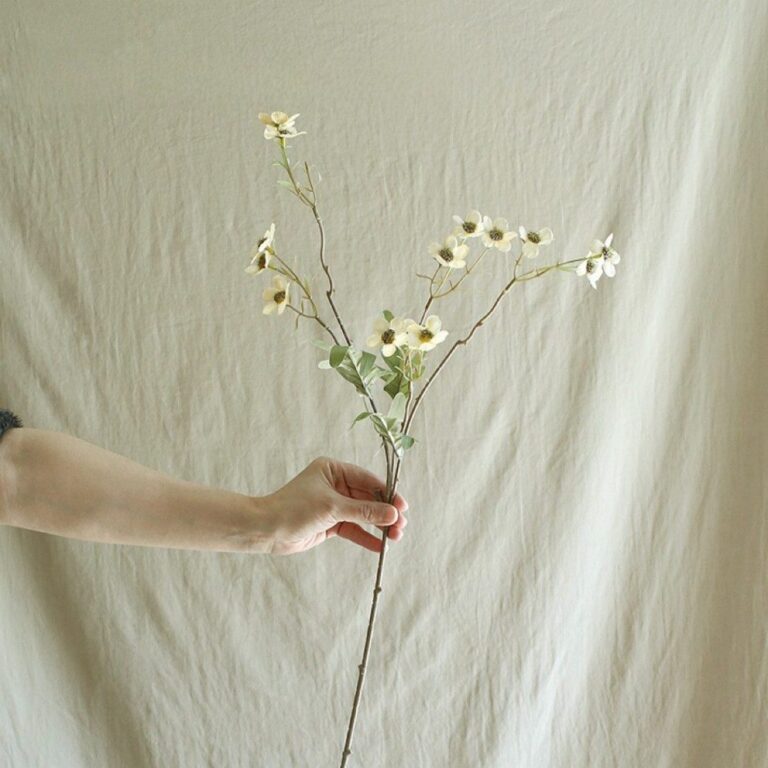 Silk vintage daisy branch with white faux flowers, ideal for delicate floral decor accents