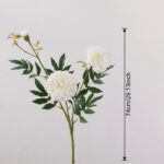 Artificial silk marigold bouquet featuring three white blooms and lush green foliage.