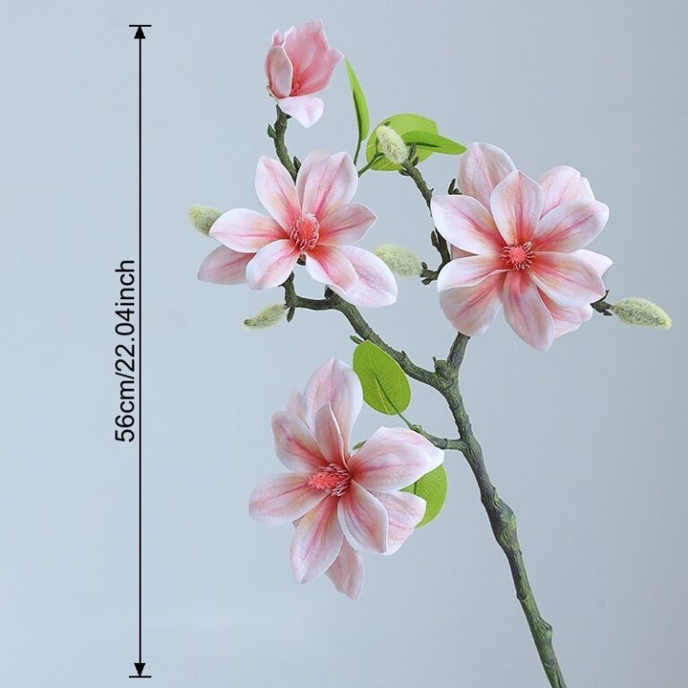 Artificial silk magnolia branch with realistic pink blossoms and green leaves for home decor.