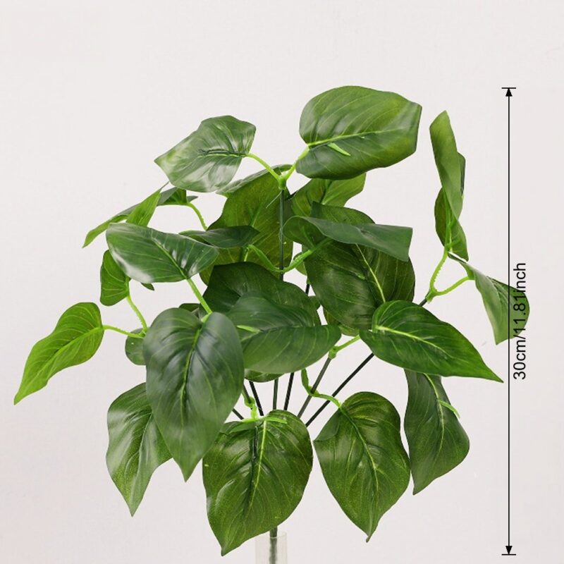 Artificial green foliage leaves for home decor and crafts, offering realistic plastic plant accents.