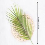 Decorative faux tropical foliage arrangement on a woven rattan accent tray