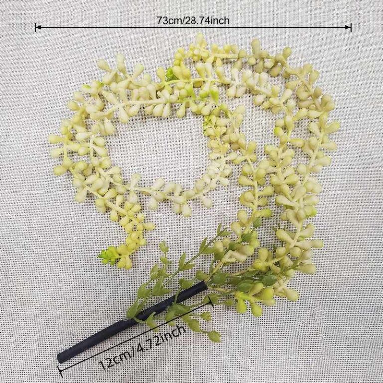 Artificial light green hanging flower garland made of PVC, perfect for wedding and home decor.