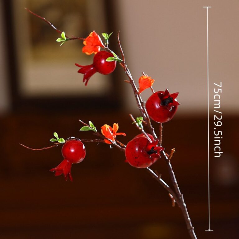 Artificial pomegranate branch décor with realistic foam fruit, ideal for rustic holiday centerpieces.