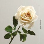 Realistic artificial rose bloom on stem, ideal as fake wedding or home decorative flowers.