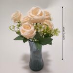 Faux silk rose bouquet featuring seven blush blooms in an elegant decorative vase.