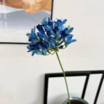 Vibrant blue silk Agapanthus artificial flower stem for durable home decor.