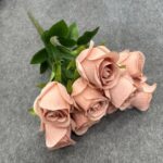 Bouquet of light pink artificial rose flowers featuring realistic silk petals.
