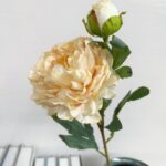 Beautiful artificial flower bouquet featuring two large silk peony blooms.