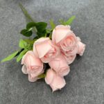 Bouquet of light pink artificial flower silk rose heads for home decoration.