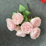 Cluster of seven realistic pink silk artificial roses with green leaves for home decor