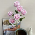 Realistic bouquet of silk rose artificial flowers for home decor.