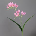 Pink artificial flower freesias with realistic silk petals for home decor.