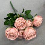Artificial pink silk rose bouquet featuring seven realistic heads on green stems.
