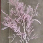 Artificial flower arrangement of delicate pink branches, perfect for decorative floral decor.