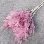 Bouquet of pink, frosted artificial flowers, ideal as decorative silk floral arrangement.