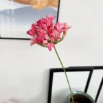 Pink silk flower artificial flower arrangement of realistic Agapanthus blooms.